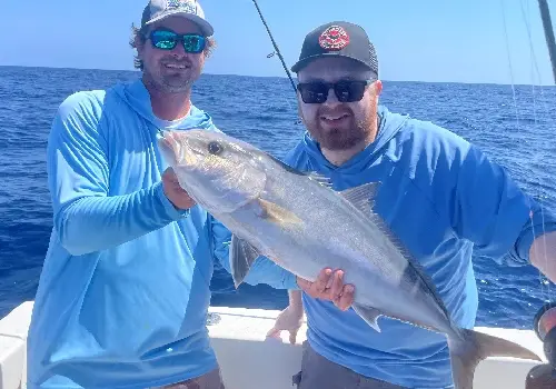 Happy fisherperson showing off their catch during Inshore Fishing of the coast of St. Pete Beach FL